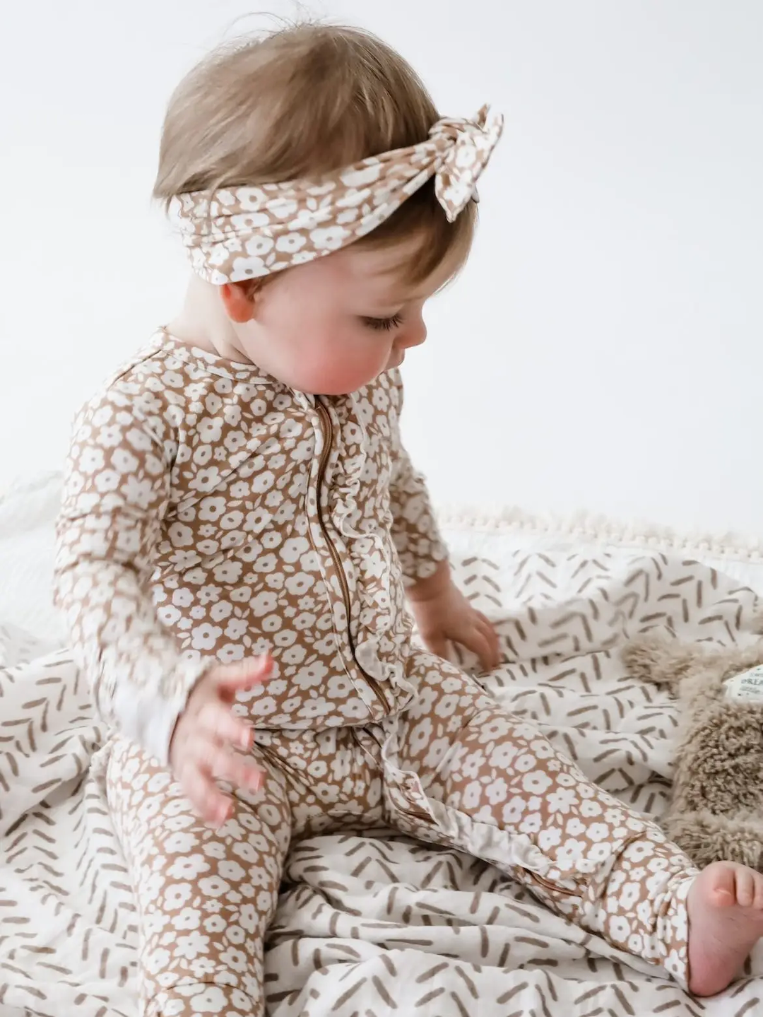 mocha ditsy zipper romper and headband on baby